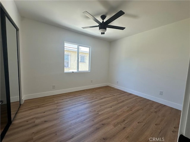 1253 W 65th St, Los Angeles, CA 90044 - unfurnished bedroom with wood finished floors and a ceiling fan