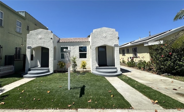 1253 W 65th St, Los Angeles, CA 90044 - mediterranean / spanish home with a tiled roof and stucco siding