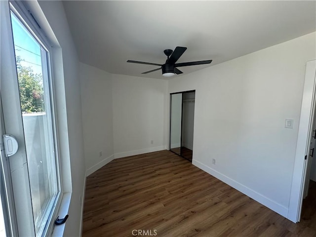 1253 W 65th St, Los Angeles, CA 90044 - unfurnished bedroom featuring wood finished floors, a closet, and ceiling fan