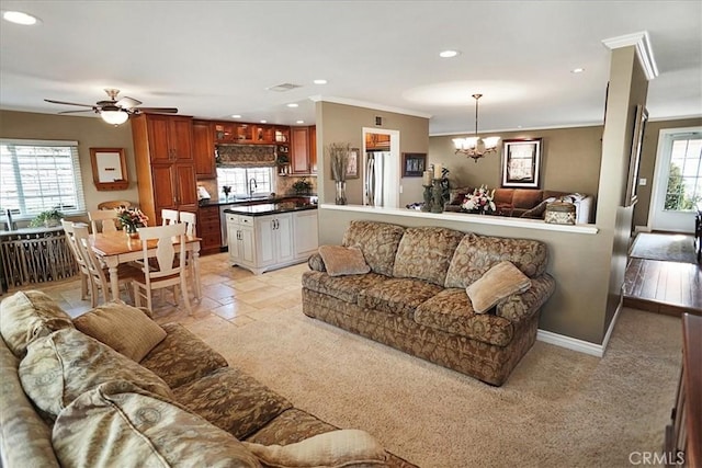 22669 Pamplico Dr, Saugus, CA 91350 - living area with recessed lighting, a chandelier, light carpet, ornamental molding, and a ceiling fan