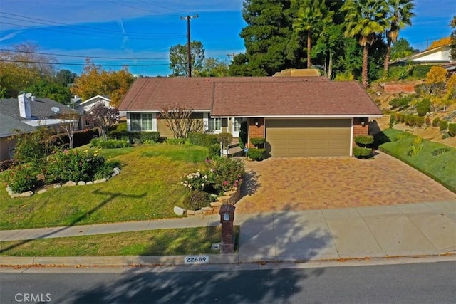 22669 Pamplico Dr, Saugus, CA 91350 - ranch-style house with an attached garage, driveway, and a front lawn