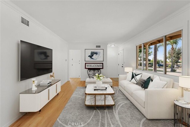 604 Sequoia St, San Bernardino, CA 92407 - living room with light wood finished floors and ornamental molding