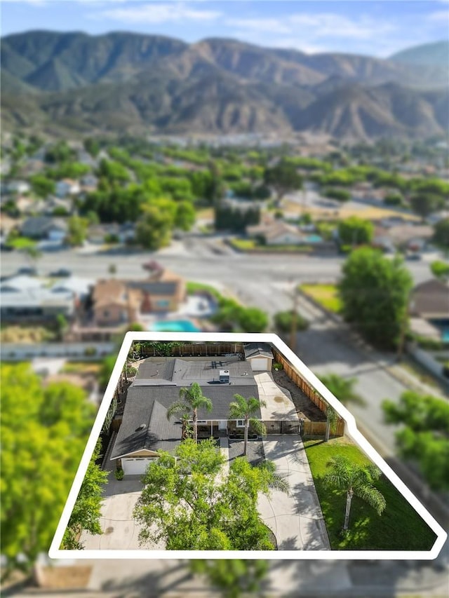 604 Sequoia St, San Bernardino, CA 92407 - view from above of property featuring property parcel outlined and a mountain backdrop