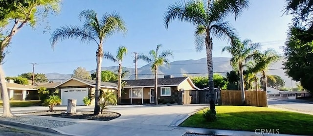 604 Sequoia St, San Bernardino, CA 92407 - ranch-style home with a mountain view, a garage, and driveway
