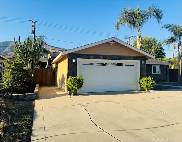 604 Sequoia St, San Bernardino, CA 92407 - view of front of house featuring stucco siding, concrete driveway, and an attached garage