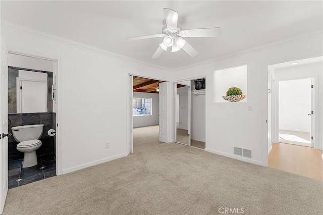 604 Sequoia St, San Bernardino, CA 92407 - unfurnished bedroom featuring carpet flooring, ornamental molding, a closet, and a ceiling fan