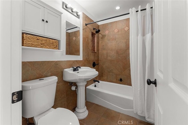 604 Sequoia St, San Bernardino, CA 92407 - full bath featuring tile walls, shower / bath combo with shower curtain, tile patterned floors, and recessed lighting