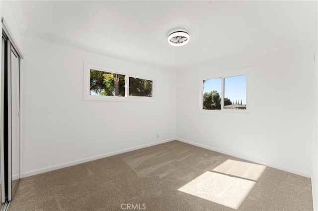 604 Sequoia St, San Bernardino, CA 92407 - unfurnished bedroom with carpet, crown molding, and a closet