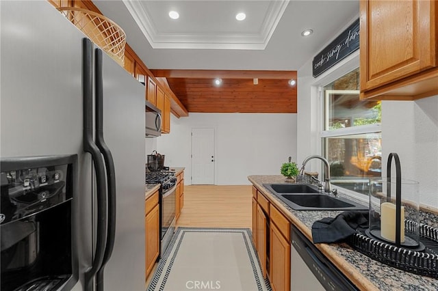 604 Sequoia St, San Bernardino, CA 92407 - kitchen with stainless steel appliances, recessed lighting, a raised ceiling, ornamental molding, and light wood-style floors