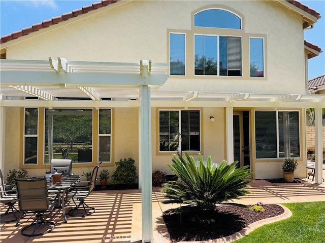 7004 Wildrose Ter, Carlsbad, CA 92011 - rear view of house with a pergola, stucco siding, and a patio