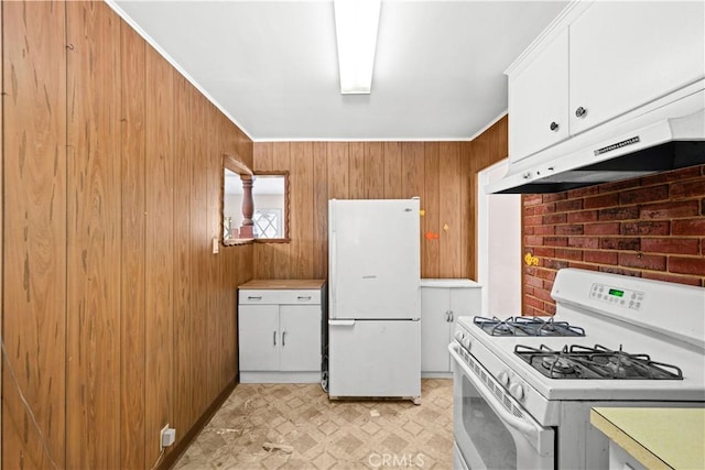 631 N Evergreen St, Burbank, CA 91505 - kitchen with white appliances, under cabinet range hood, wood walls, light flooring, and white cabinetry