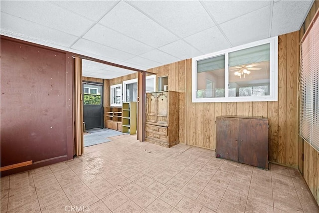 631 N Evergreen St, Burbank, CA 91505 - empty room with wooden walls, a paneled ceiling, and tile patterned floors