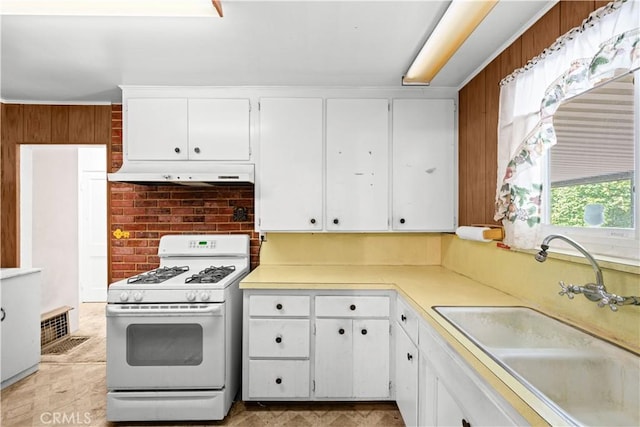 631 N Evergreen St, Burbank, CA 91505 - kitchen featuring white gas range oven, under cabinet range hood, white cabinets, and light countertops