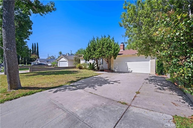 631 N Evergreen St, Burbank, CA 91505 - view of front of house featuring a front lawn, driveway, and a garage