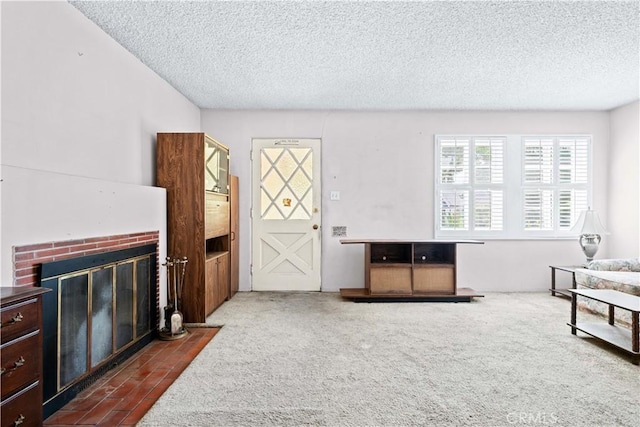 631 N Evergreen St, Burbank, CA 91505 - unfurnished living room with a brick fireplace, dark colored carpet, and a textured ceiling