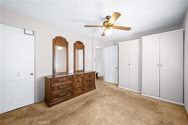 631 N Evergreen St, Burbank, CA 91505 - carpeted bedroom featuring multiple closets, a textured ceiling, and ceiling fan
