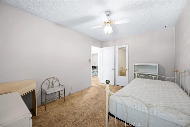 631 N Evergreen St, Burbank, CA 91505 - bedroom with carpet floors, a textured ceiling, and a ceiling fan