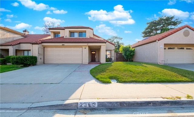 2383 Hampton Ave, Simi Valley, CA 93063 - mediterranean / spanish house featuring a front lawn, stucco siding, a tile roof, concrete driveway, and a garage