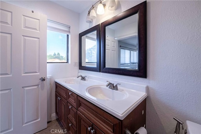 2383 Hampton Ave, Simi Valley, CA 93063 - bathroom featuring double vanity and a textured wall