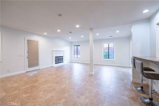 2383 Hampton Ave, Simi Valley, CA 93063 - unfurnished living room with a glass covered fireplace and recessed lighting