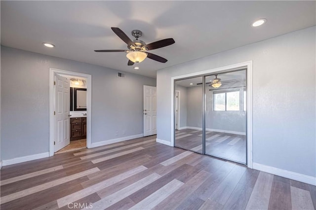 2383 Hampton Ave, Simi Valley, CA 93063 - unfurnished bedroom with wood finished floors, recessed lighting, a ceiling fan, a closet, and ensuite bathroom