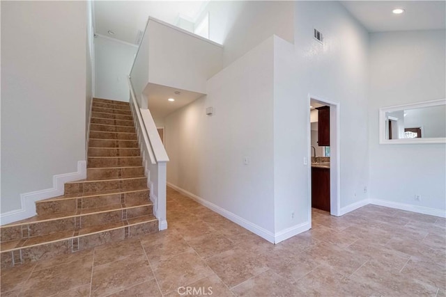 2383 Hampton Ave, Simi Valley, CA 93063 - stairway featuring a high ceiling and baseboards