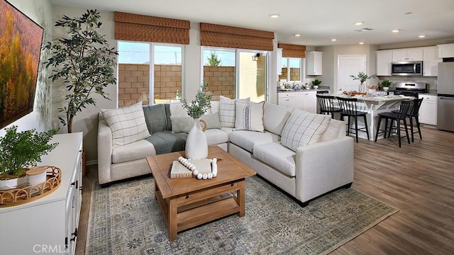 30753 Viper Ct, Winchester, CA 92596 - living area featuring healthy amount of natural light, wood finished floors, and recessed lighting