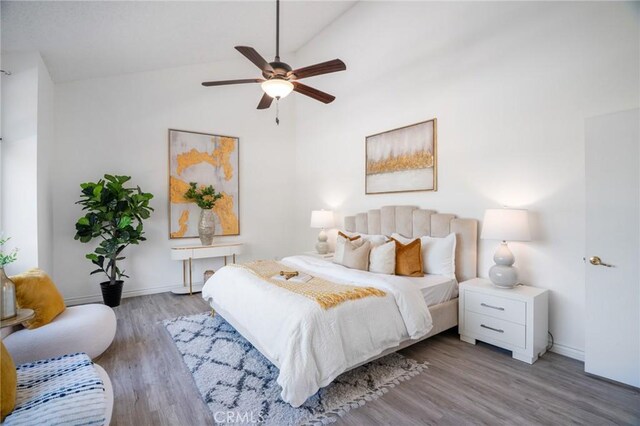 7029 Novara Pl, Rancho Cucamonga, CA 91701 - bedroom featuring lofted ceiling, wood finished floors, and a ceiling fan