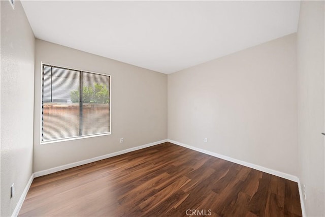 2988 Dartmouth Cir, Corona, CA 92879 - spare room featuring dark wood-style floors and baseboards