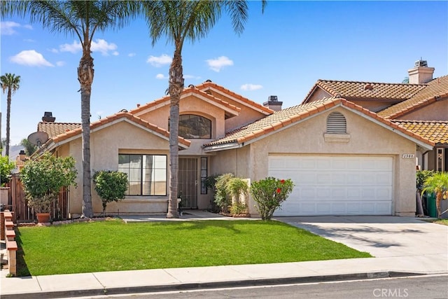2988 Dartmouth Cir, Corona, CA 92879 - mediterranean / spanish-style house with an attached garage, stucco siding, concrete driveway, a front yard, and a tiled roof