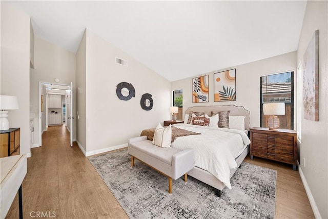 2988 Dartmouth Cir, Corona, CA 92879 - bedroom with multiple windows, wood finished floors, and high vaulted ceiling