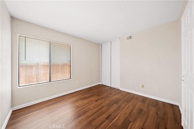 2988 Dartmouth Cir, Corona, CA 92879 - empty room with dark wood finished floors and baseboards
