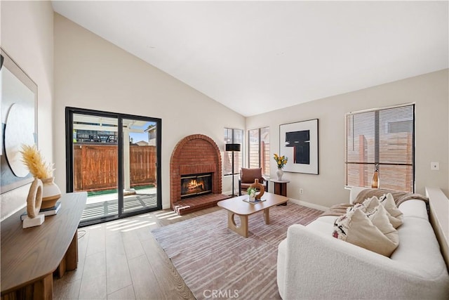 2988 Dartmouth Cir, Corona, CA 92879 - living room featuring wood finished floors, a brick fireplace, and high vaulted ceiling