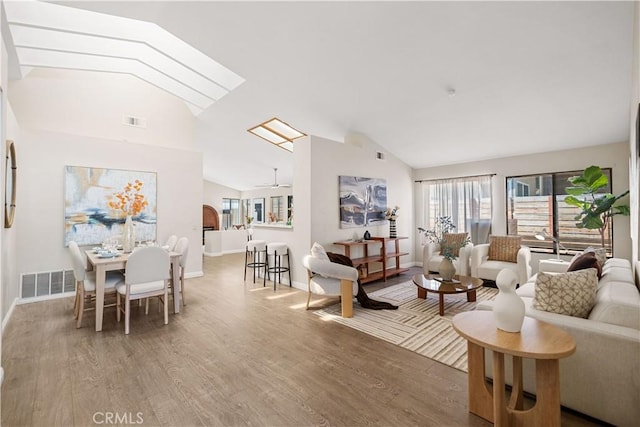 2988 Dartmouth Cir, Corona, CA 92879 - living room with vaulted ceiling, wood finished floors, and a ceiling fan