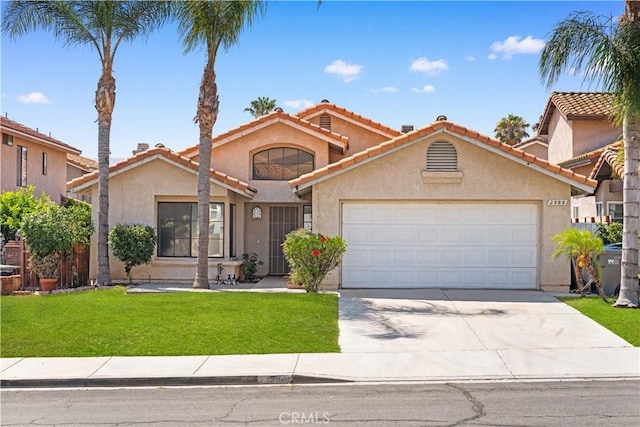 2988 Dartmouth Cir, Corona, CA 92879 - mediterranean / spanish home with stucco siding, a garage, driveway, a front lawn, and a tile roof