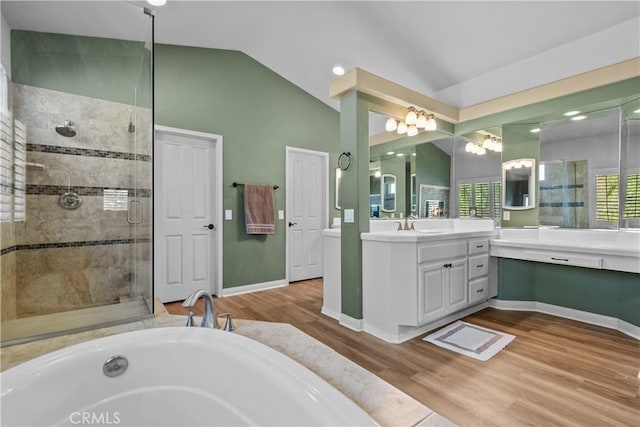 15355 Michael Crest Dr, Canyon Country, CA 91387 - full bath featuring vaulted ceiling, vanity, a stall shower, wood finished floors, and a bath