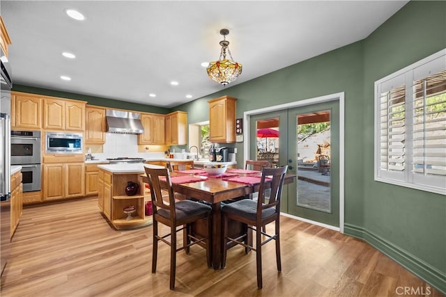 15355 Michael Crest Dr, Canyon Country, CA 91387 - dining room featuring healthy amount of natural light, light wood-type flooring, french doors, and recessed lighting