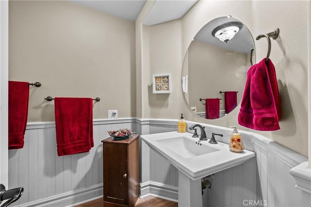 15355 Michael Crest Dr, Canyon Country, CA 91387 - bathroom featuring a wainscoted wall and wood finished floors