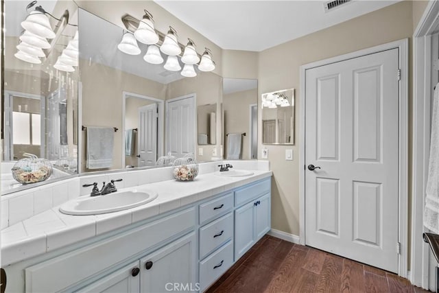 15355 Michael Crest Dr, Canyon Country, CA 91387 - bathroom with double vanity and wood finished floors