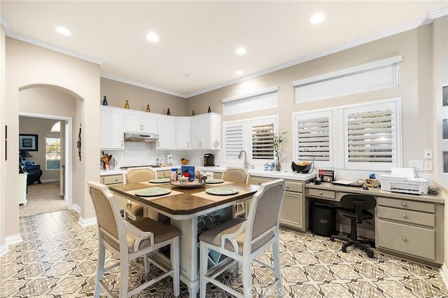 2157 Pecan Tree St, Hemet, CA 92545 - dining space featuring recessed lighting, light tile patterned floors, arched walkways, inlaid floor details, and crown molding