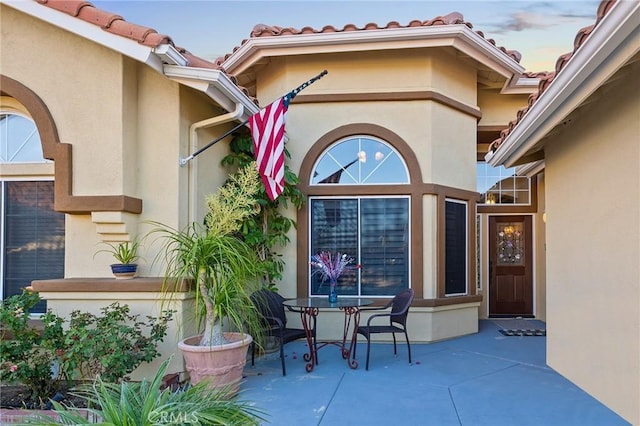 2157 Pecan Tree St, Hemet, CA 92545 - property entrance featuring a patio, stucco siding, and a tiled roof