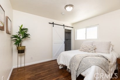 1939 S Broadway, Escondido, CA 92025 - bedroom with a barn door and wood finished floors