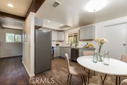 1939 S Broadway, Escondido, CA 92025 - kitchen with stainless steel appliances, dark wood-style floors, gray cabinets, healthy amount of natural light, and recessed lighting