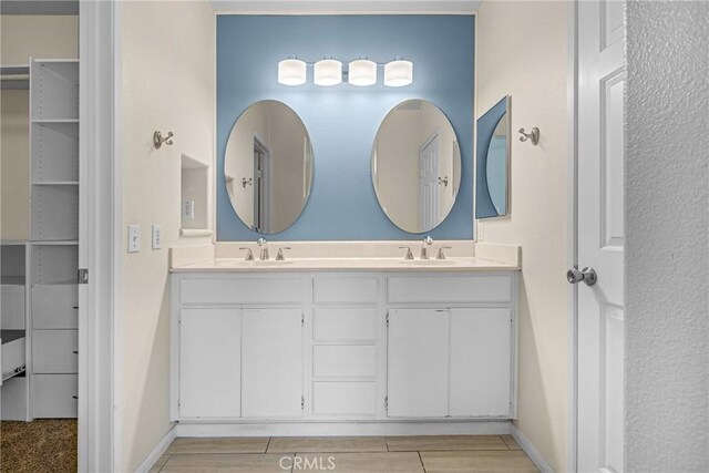 39635 Columbia Union Dr Unit C, Murrieta, CA 92563 - full bathroom featuring double vanity and baseboards