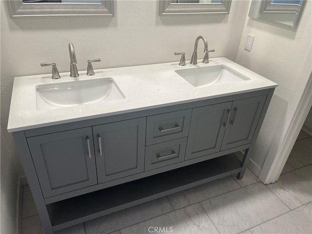 552 Canyon Dr Unit 38, Oceanside, CA 92054 - bathroom with double vanity and marble look tiles