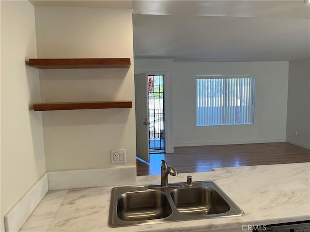 552 Canyon Dr Unit 38, Oceanside, CA 92054 - kitchen with wood finished floors, light countertops, and open shelves