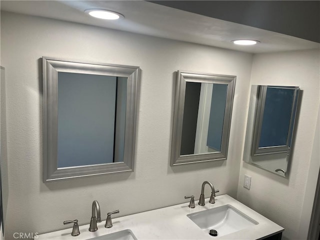 552 Canyon Dr Unit 38, Oceanside, CA 92054 - bathroom featuring double vanity and recessed lighting