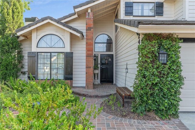 24042 Ingomar St, West Hills, CA 91304 - property entrance featuring a chimney