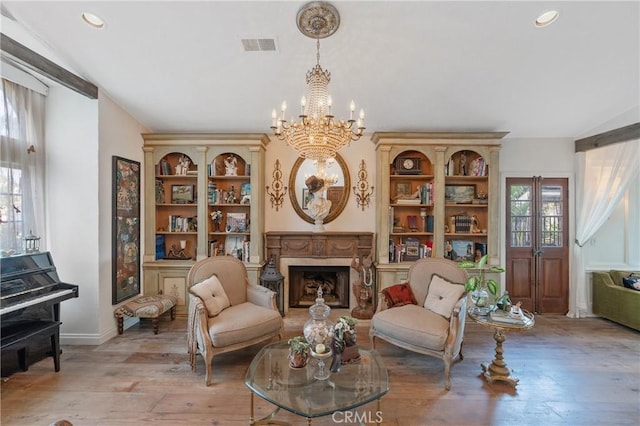24042 Ingomar St, West Hills, CA 91304 - sitting room with a chandelier, light wood-type flooring, a premium fireplace, and recessed lighting