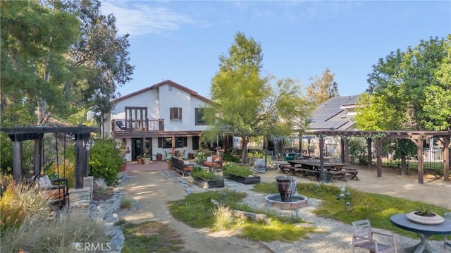 24042 Ingomar St, West Hills, CA 91304 - rear view of house with a pergola, a balcony, and a patio